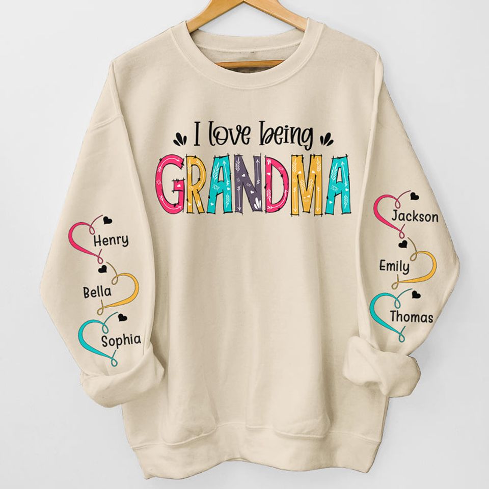 I Love Being Grandma - Family Personalized Custom Unisex Sweatshirt With Design On Sleeve - Christmas Gift For Mom, Grandma